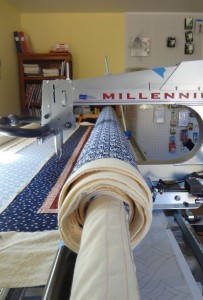 Three Quilts Rolled Up